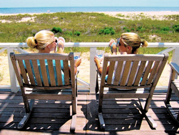 Two Ladies Sitting on Deck at Beach